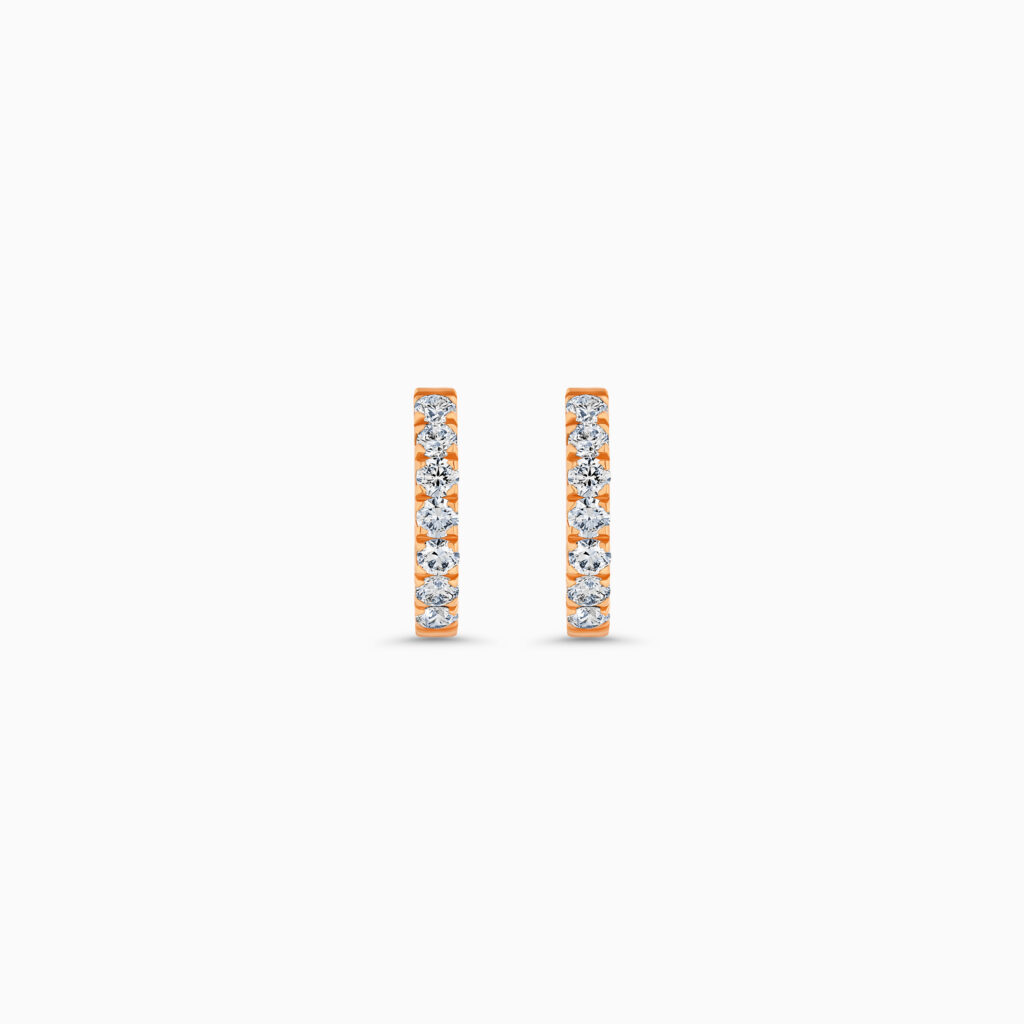 "18K rose gold huggie earrings with diamonds "