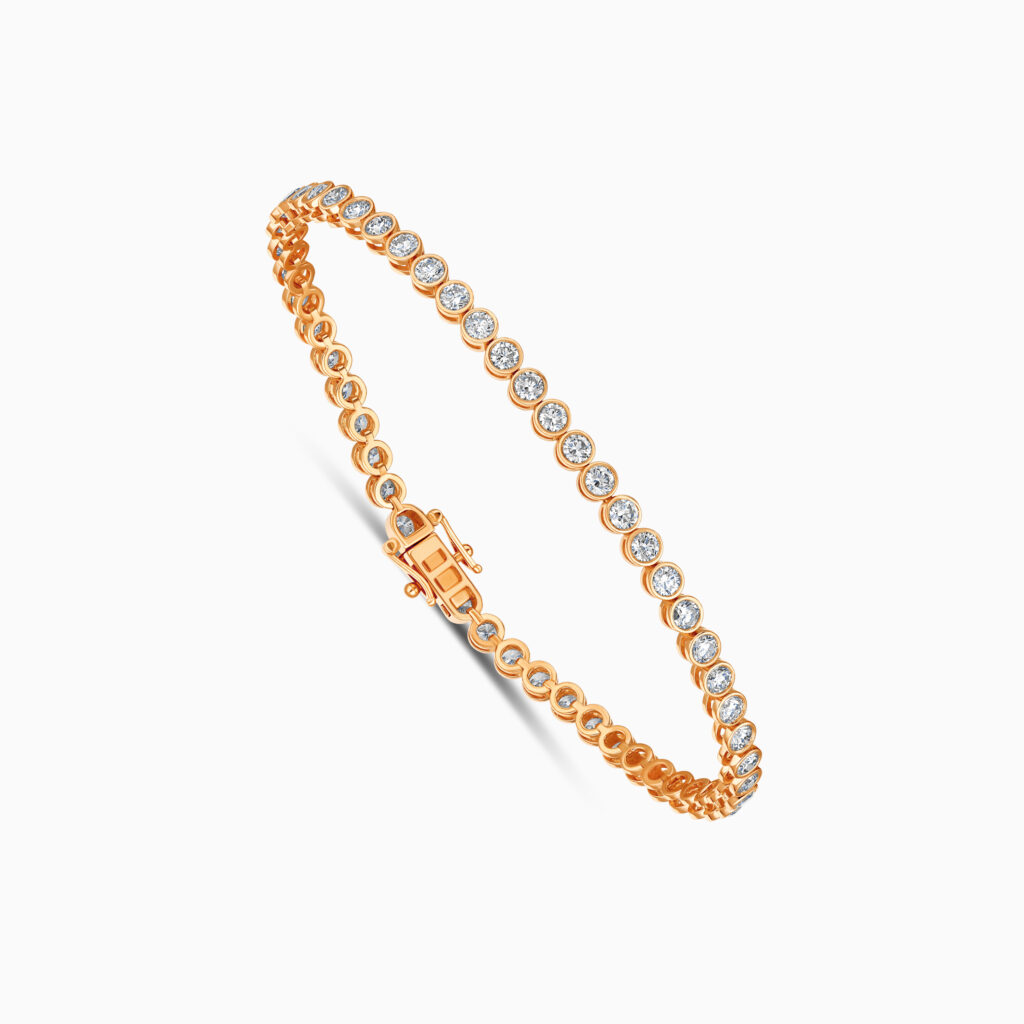 "18K rose gold diamond tennis bracelet with bezel setting "