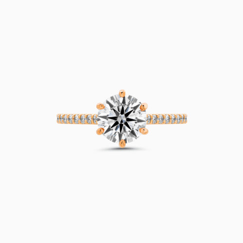 Engagement Ring With A Round Brilliant Diamond And Side Stones In 18K
