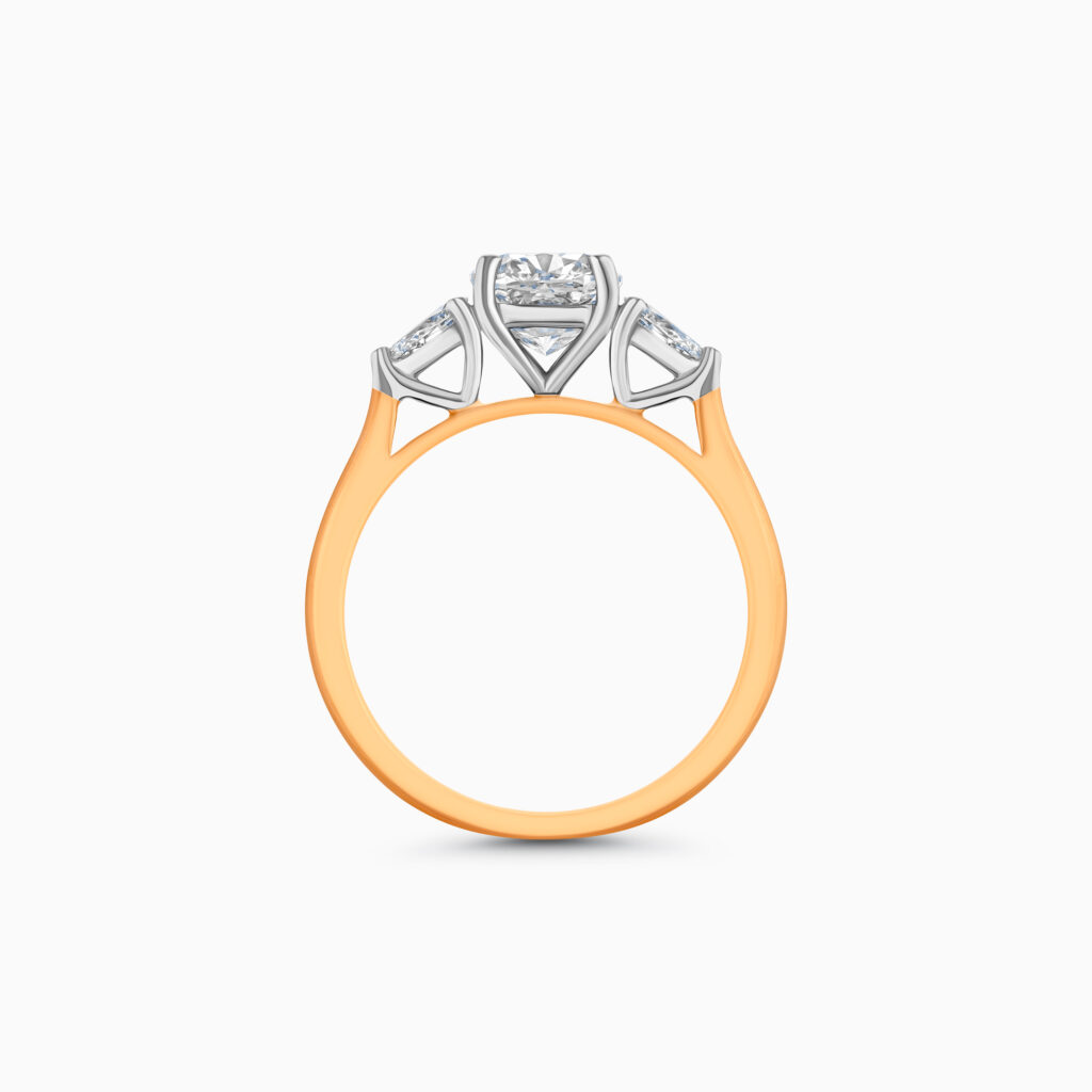 Yellow gold trilogy ring with cushion diamond